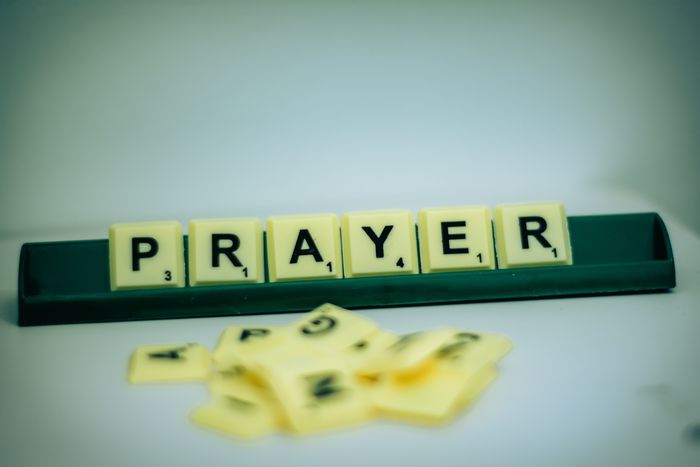 The word prayer on tiles: Photo by Alex Shute on Unsplash